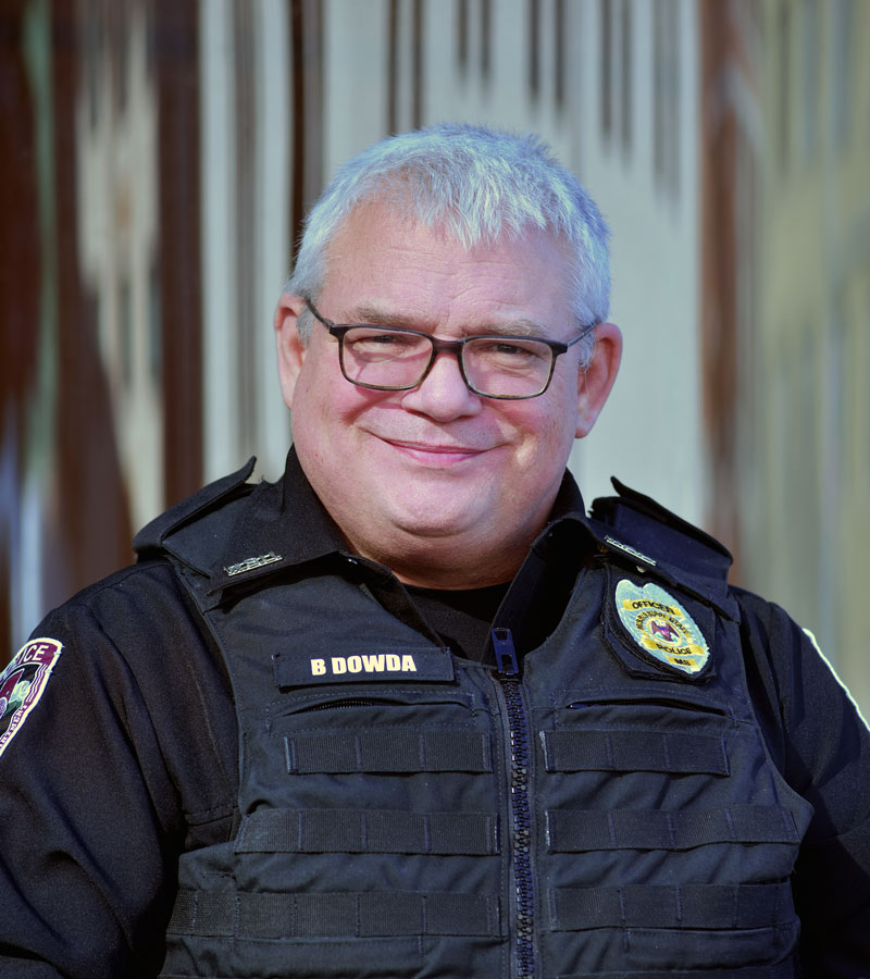 Officer Bill Dowda wearing glasses in his Police Uniform