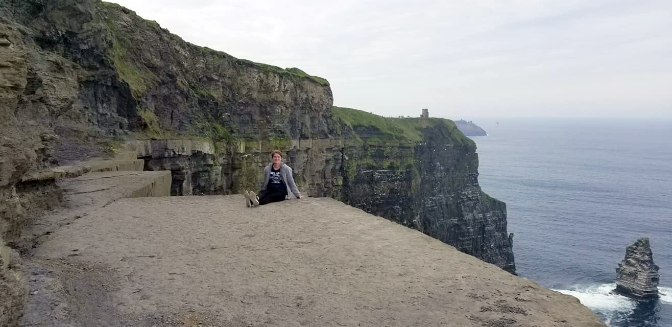 Natalie Cartulla, an MSU-Meridian business student from Quitman, sits on a ledge of the Cliffs of Moher in Ireland. She was a recent participant in a study abroad course through Mississippi State University’s College of Business. (Photo submitted)