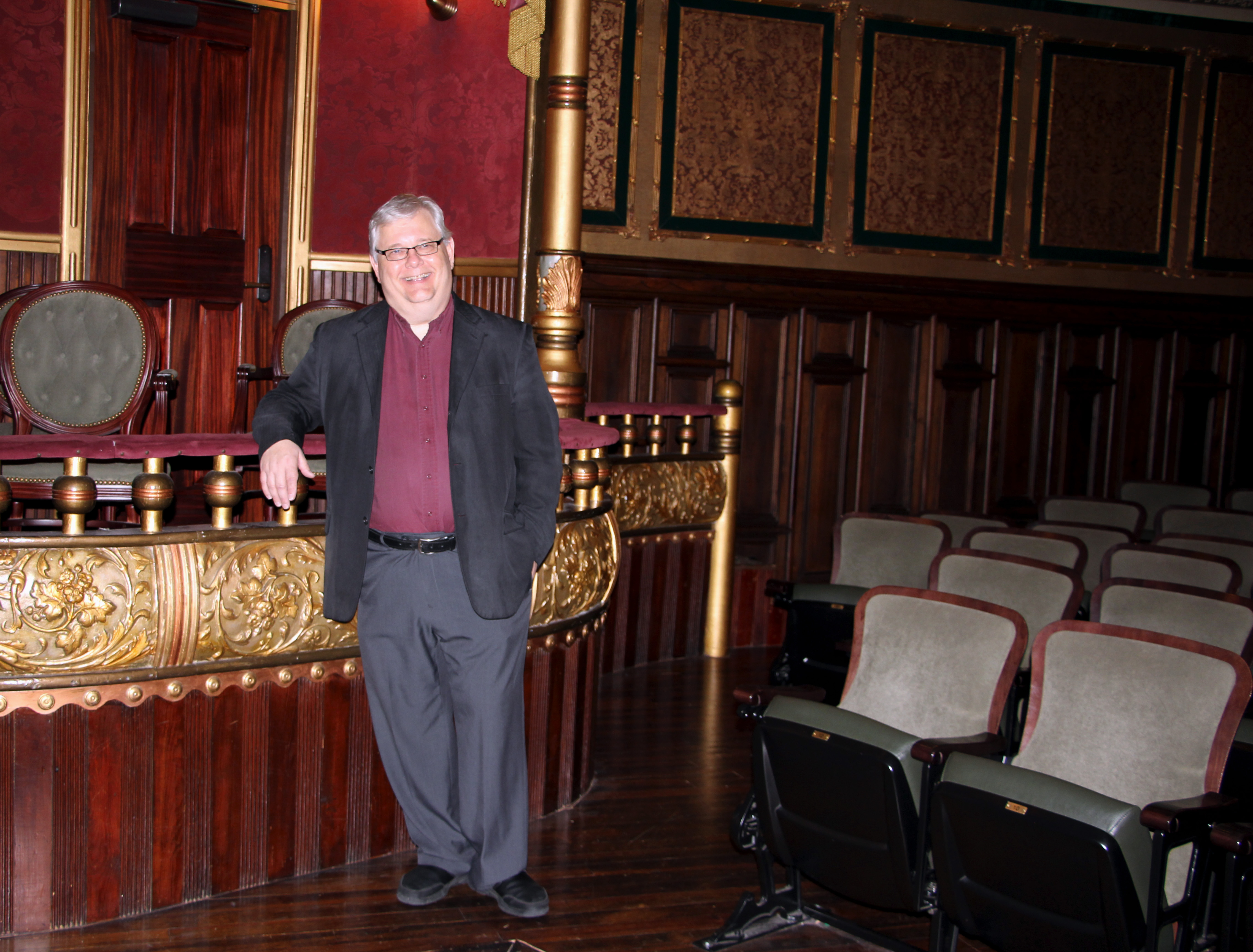 Dennis Sankovich stands in the restored grand opera house which became the home of the MSU Riley Center in 2006 