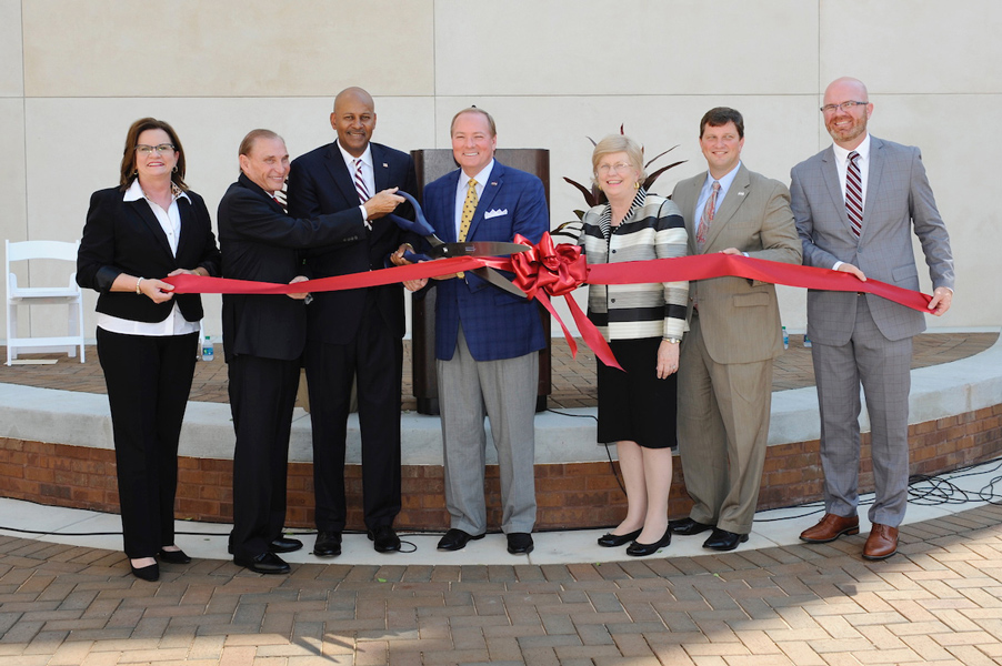 MSU PHOTO ID: Celebrating a ribbon-cutting ceremony for the new Riley Campus Courtyard in downtown Meridian Aug. 4 are (l-r) MSU Vice President for Campus Services Amy Tuck; President of The Riley Foundation Marty Davidson; Meridian Mayor Percy Bland; MSU President Mark E. Keenum; MSU Provost and Executive Vice President Judy Bonner; MSU Vice President for Development and Alumni John Rush; and MSU-Meridian Administrative Director and Head of Campus Terry Dale Cruse. (Photo by Russ Houston)