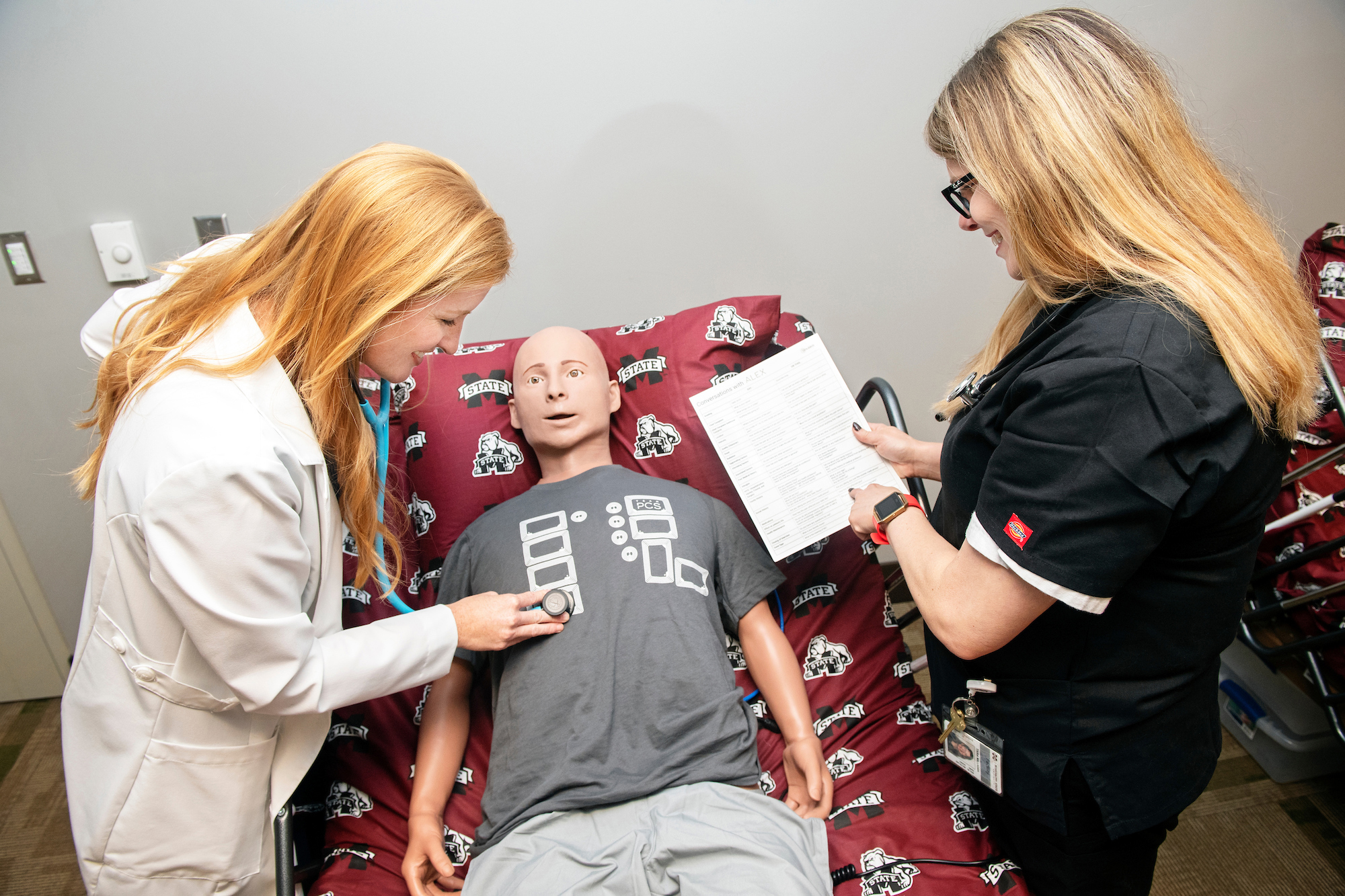 Shey Washburn, left, and Tara Milligan, assistant clinical professors with MSU-Meridian’s Master of Physician Assistant Studies program, demonstrate patient simulation equipment that will be used as part of the rigorous 29-month curriculum. The program’s 