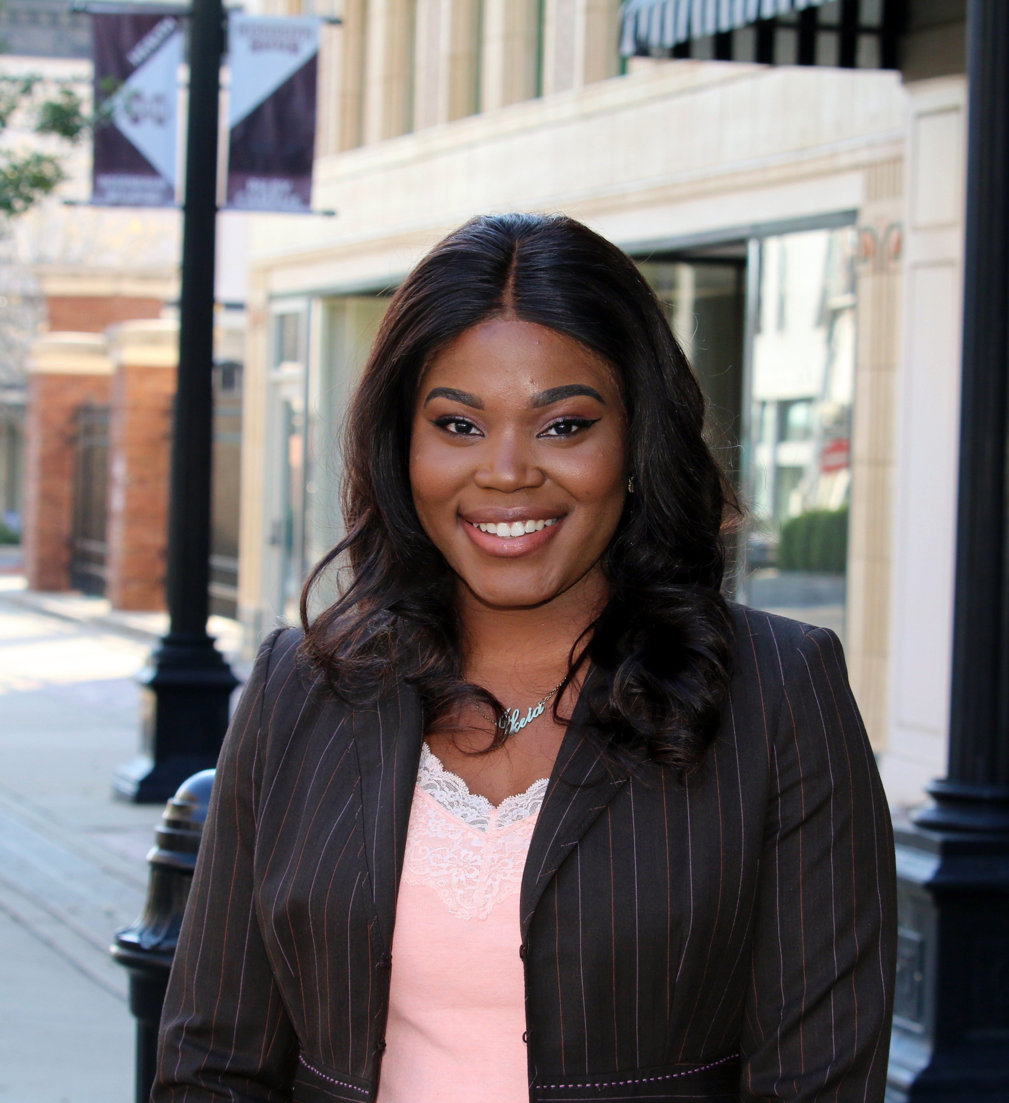 young african american female in gray striped business suit