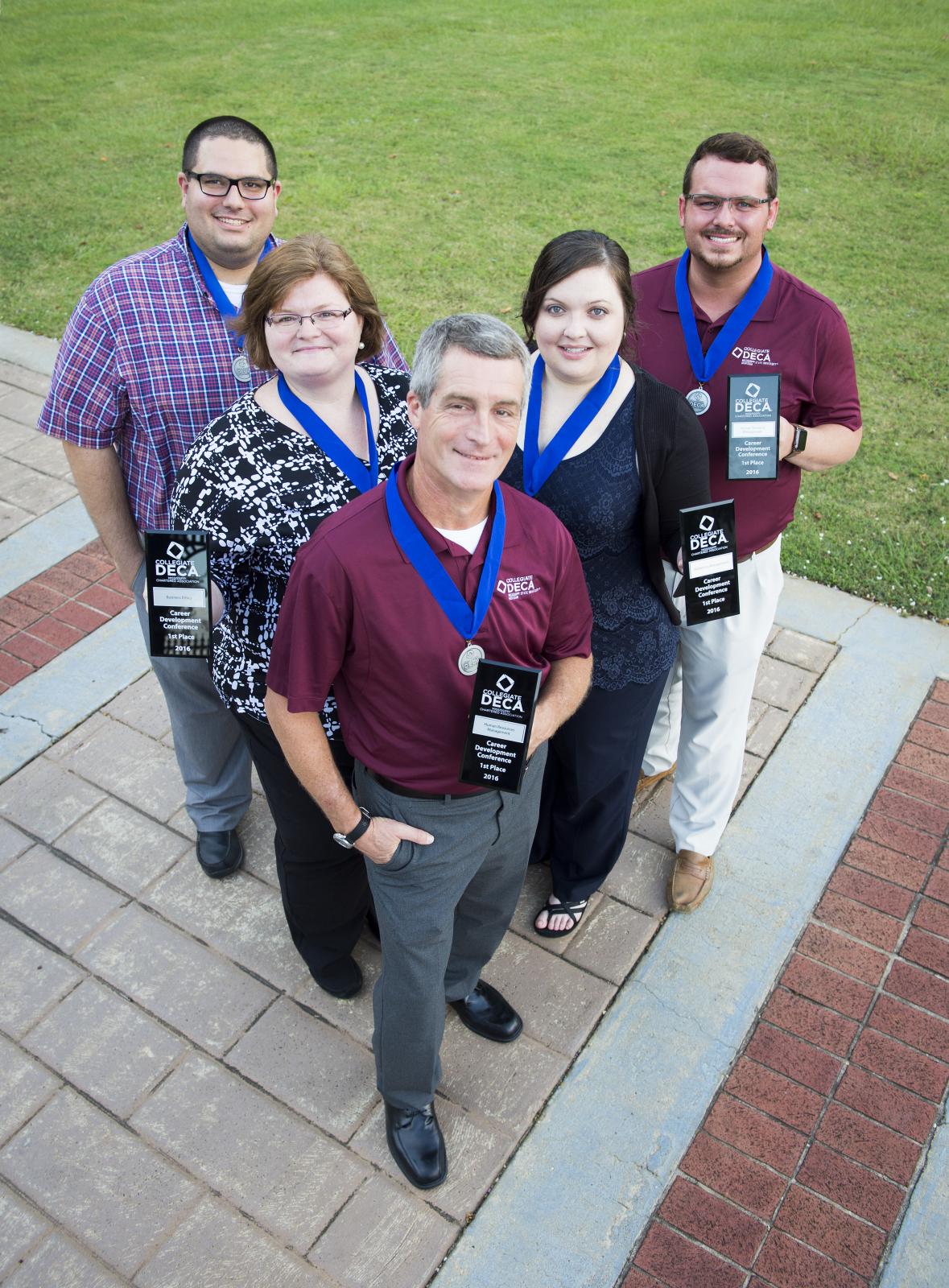 Michael Costa, Lynette Cockrell, Anthony McOlgan, Melissa Hamilton and Steven Miller pose with their 1st place trophies. Photo by Russ Houston