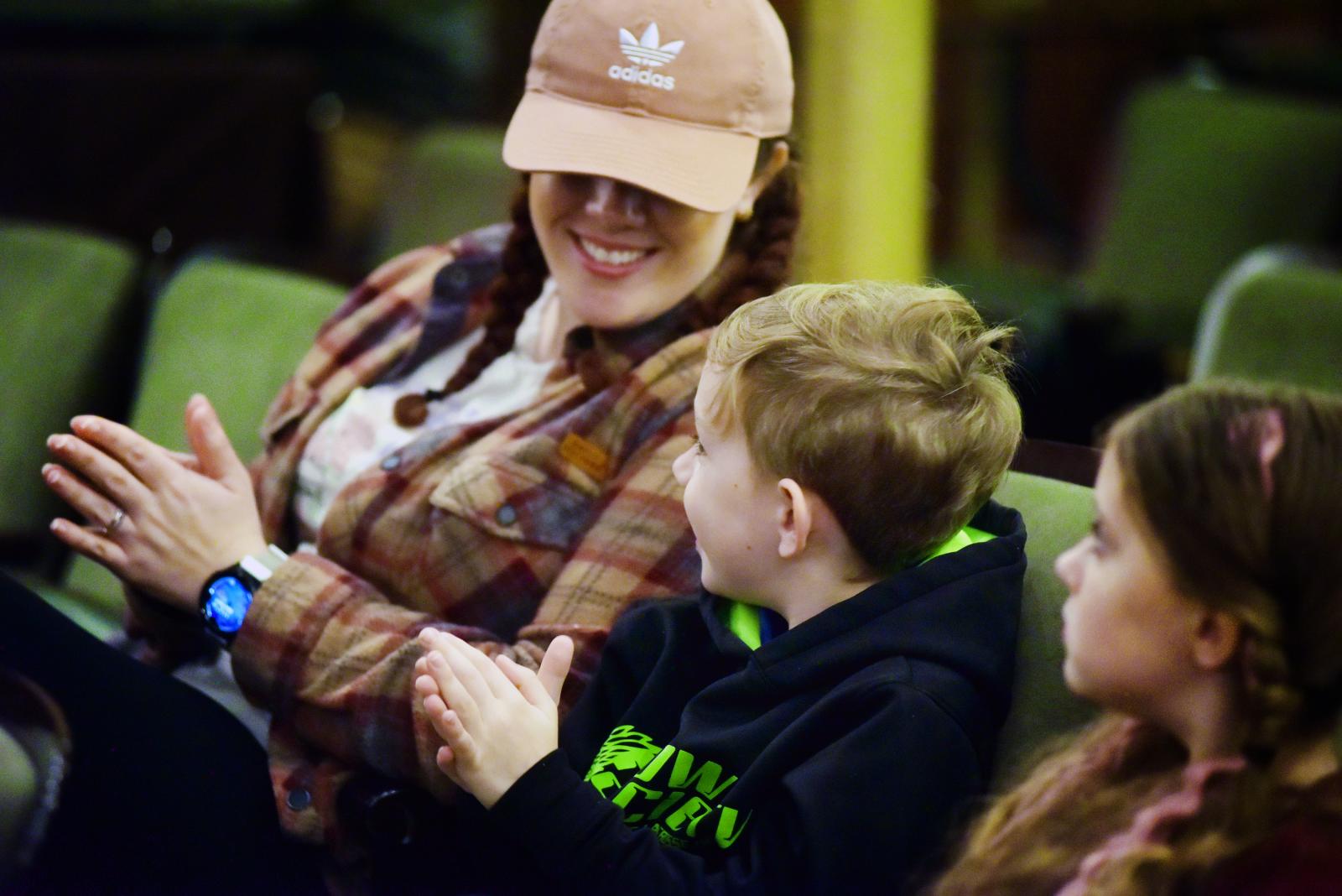 Woman laughing with children
