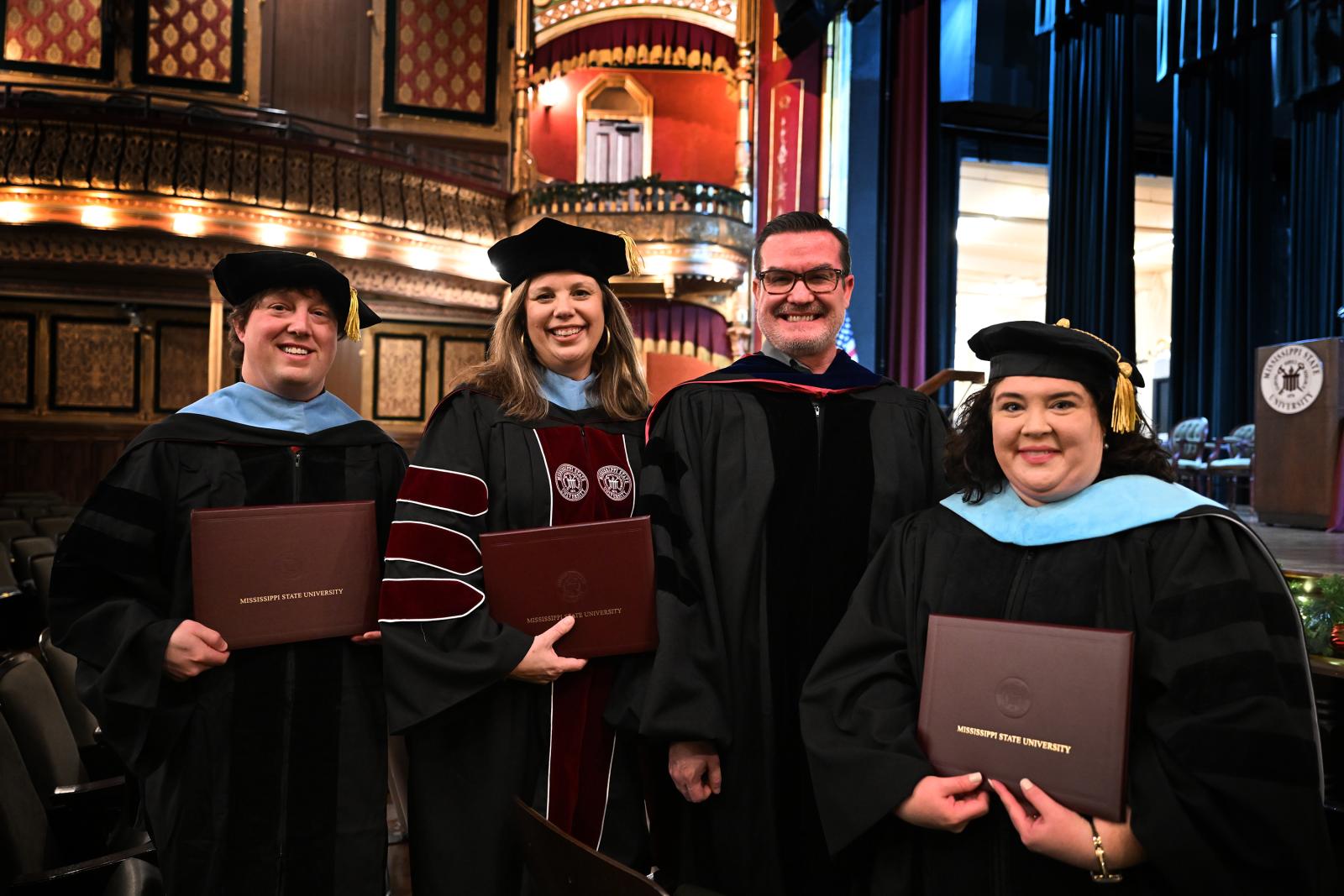 MSU PHOTO ID: Three MSU-Meridian students during Thursday’s [Dec. 12] fall commencement exercise earned the campus’ first doctoral degrees. The Doctor of Education in Educational Policy and Design was awarded to Kaleb Smith of Meridian, Michelle Stubbs of Starkville and Brandi Sumrall of Petal. Pictured with the students (second from right) is Associate Professor and Graduate Coordinator Jeff Leffler. (Photo by Marianne Todd)