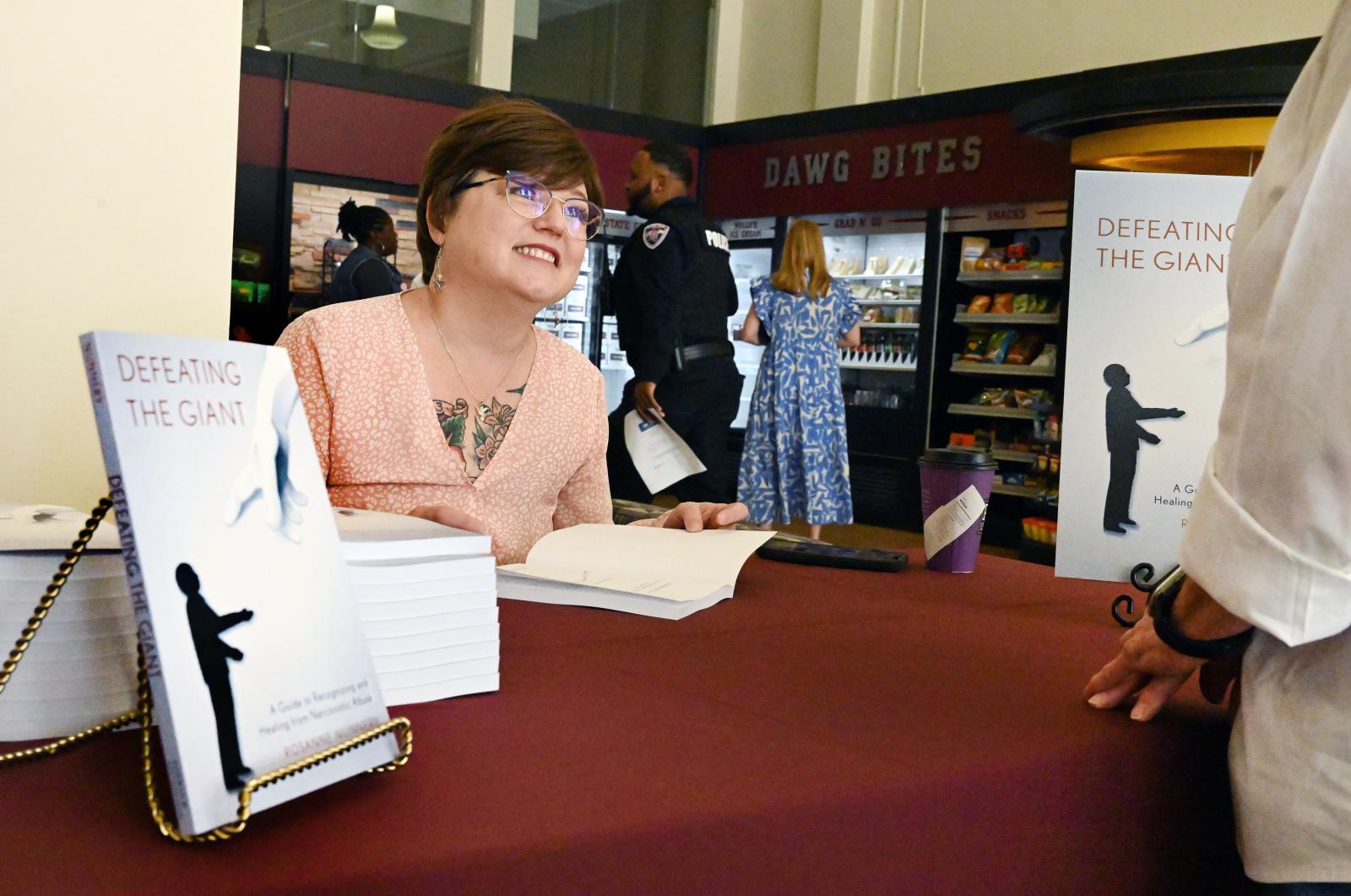 Rosanne Nunnery at book signing in bulldog shop.