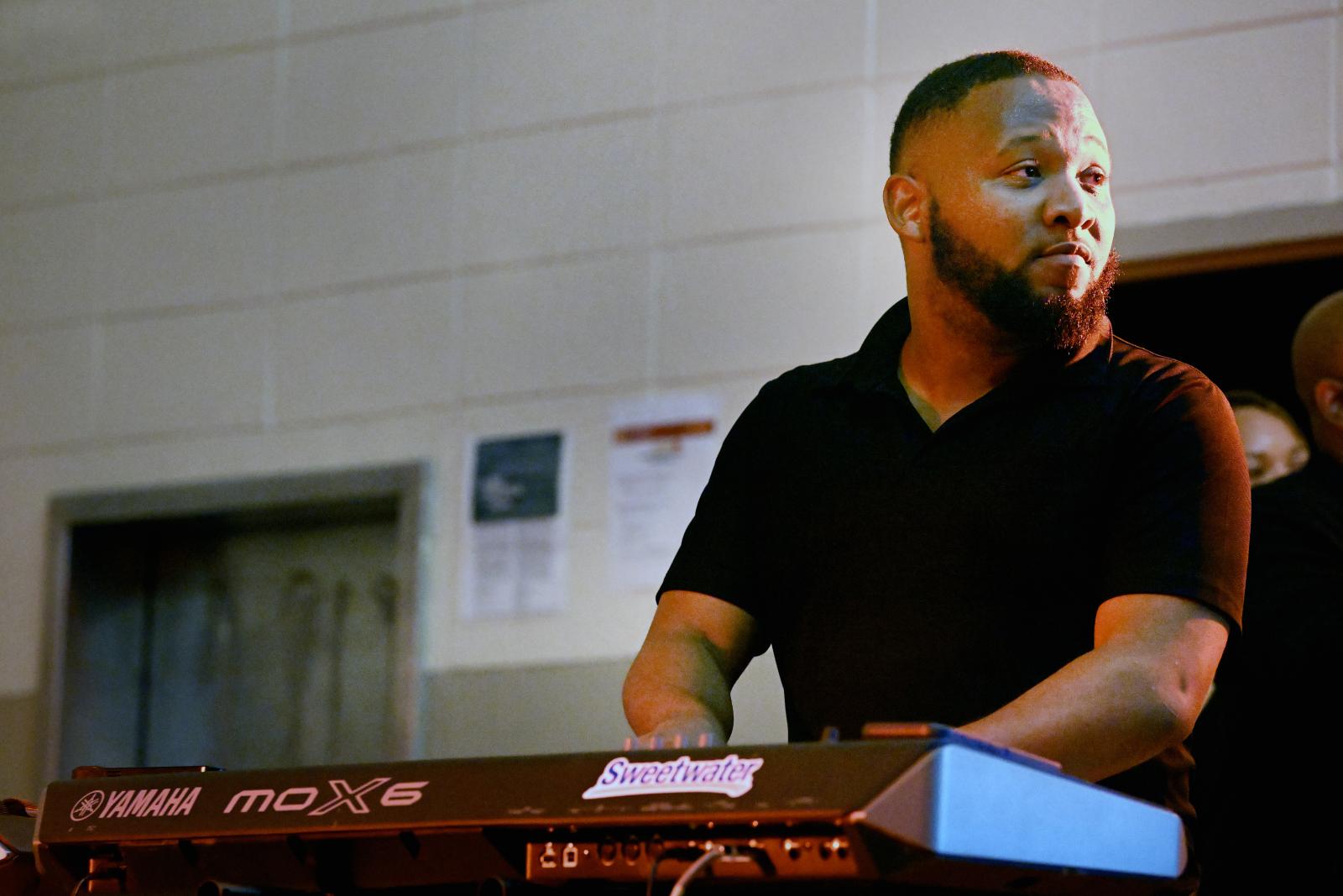 Officer Terry Boler playing the keyboard.