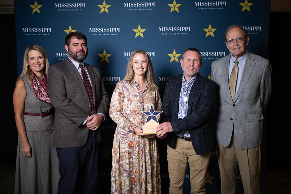 The Mississippi State University Riley Center was named the Venue of the Year during the Mississippi Governor’s Conference on Tourism held in Vicksburg on Oct. 1-3. Pictured with the award from left are Rochelle Hicks, Visit Mississippi executive director; state Sen. Jeff Tate; Morgan Dudley, MSU Riley Center director; Andy Rainey, MSU Riley Center technical director; and Lt. Gov. Delbert Hosemann.
