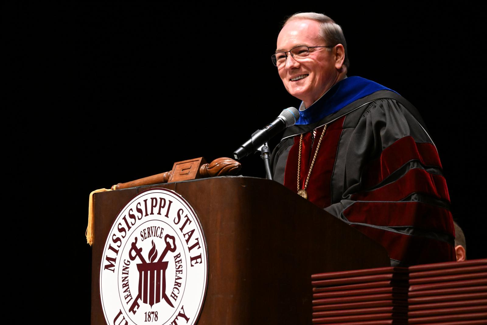 MSU President Mark E. Keenum speaks to graduates during commencement at the USM Riley Center in downtown Meridian on Thursday. (Photo by Marianne Todd)