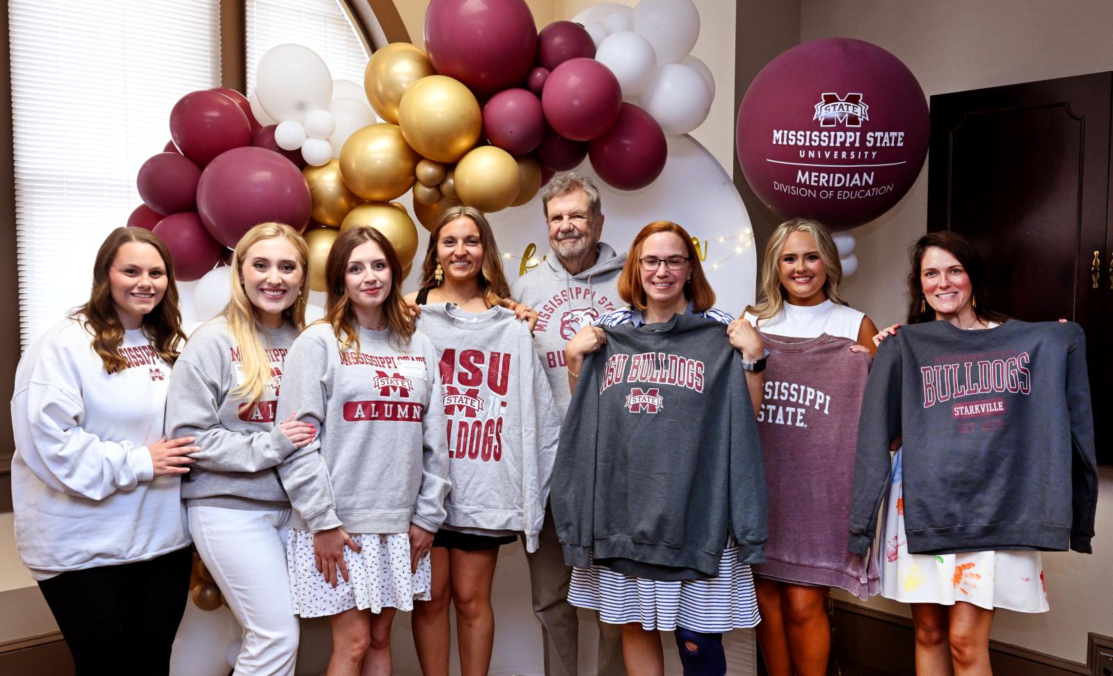 MSU PHOTO ID: Graduates from MSU-Meridian’s Professional Advancement Network for Teachers and Administrators, or PANTA, program celebrate their achievements with scholarship supporter Harry Freeman of Memphis, Tennessee, center. Pictured from left are Charleigh Conley of Bruce, Victoria Pigg of Carthage, Hope Armstrong of Kosciusko, Natalie Lampton of Decatur, Freeman, Daveyel Smith of Chunky, Lexie Usry of Decatur and Heather Martin of Decatur. (Photo by Marianne Todd)